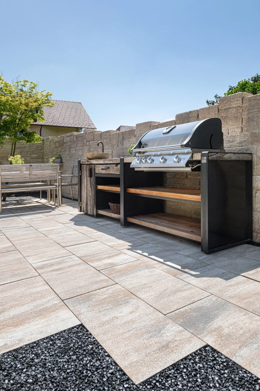 Outdoor kitchen with integrated barbecue on a terrace