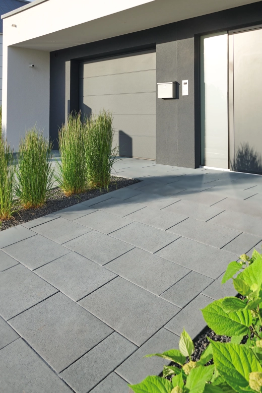 House entrance with gray paving stones in natural surface with high-quality wear-resistant facing layer