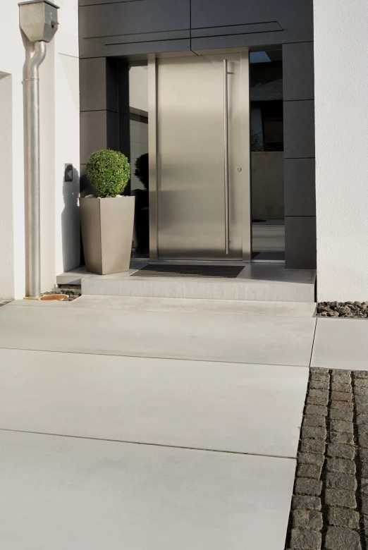 Modern house entrance with solid concrete landings