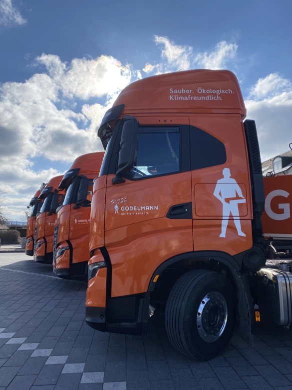 The GODELMANN LNG trucks lined up in the parking lot.