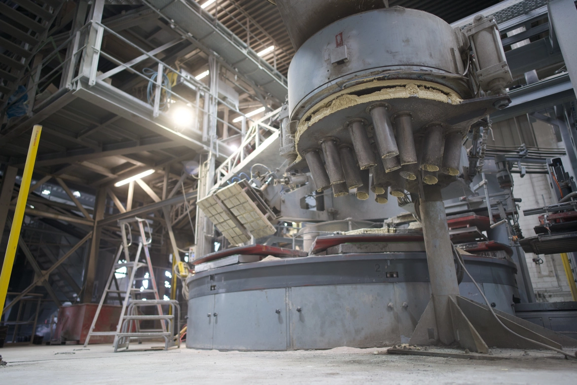 The image shows a highly complex and modern production facility that manufactures concrete slabs.