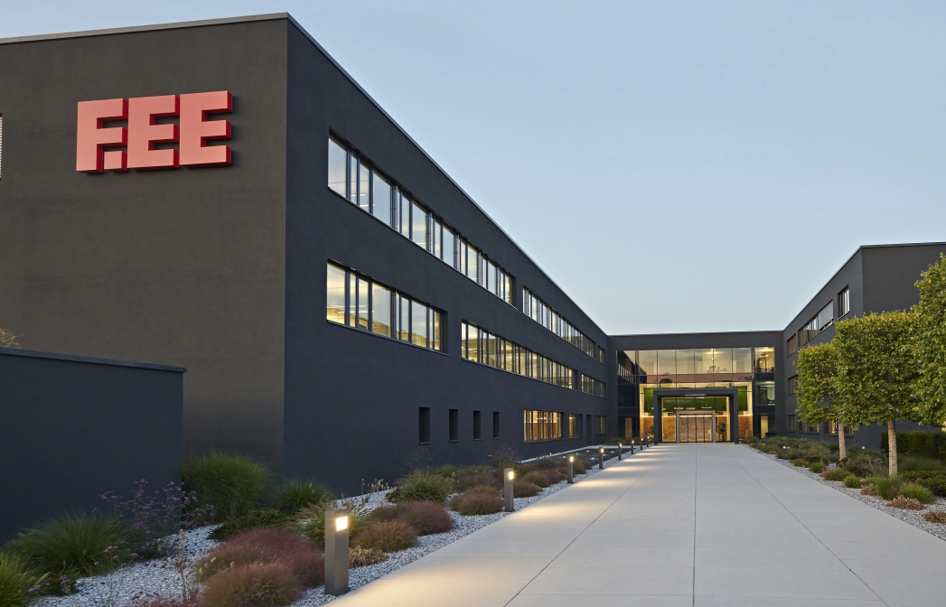 company entrance square planted