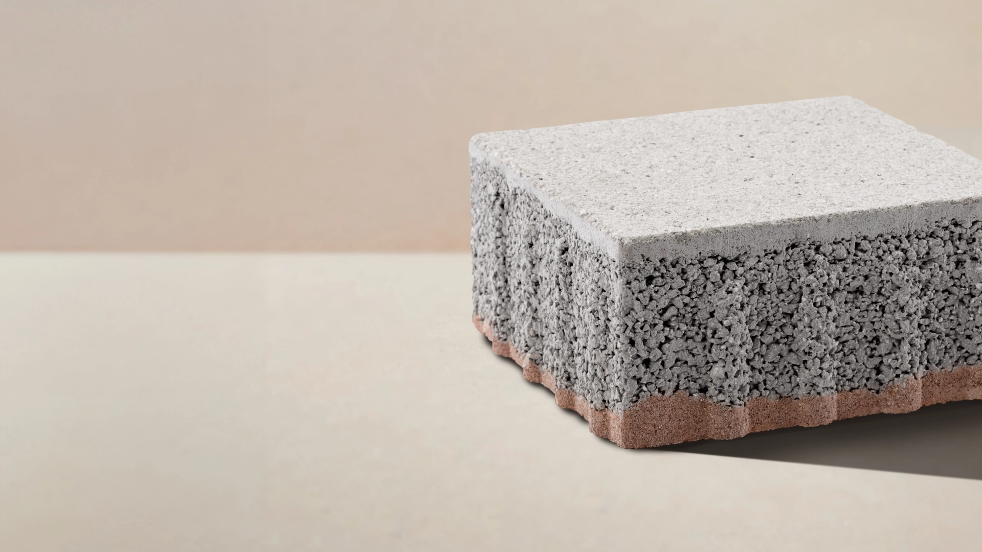 A paving stone with a three-layer structure against a beige background
