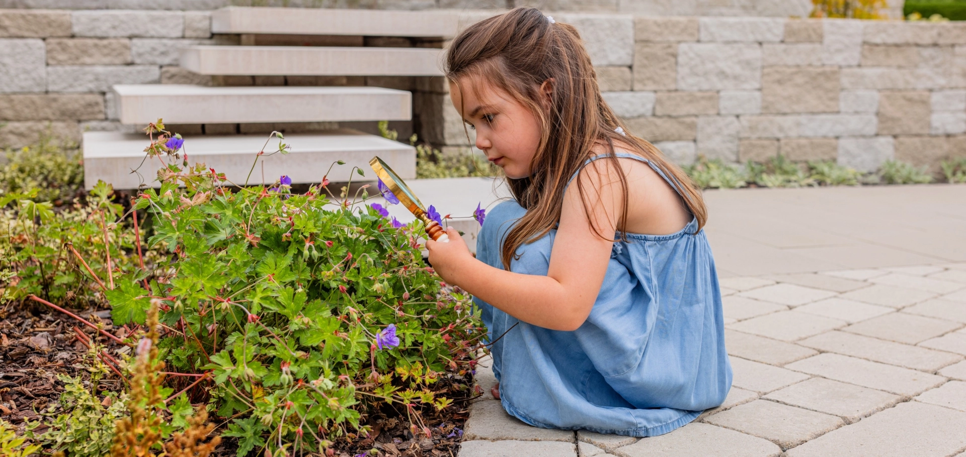 Godelmann Ideengarten, Kind mit Lupe