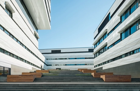 Spacious staircase between two bright modern buildings 