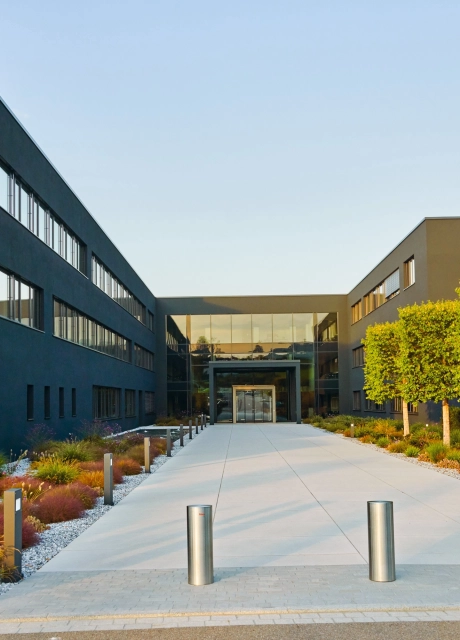 company entrance square planted