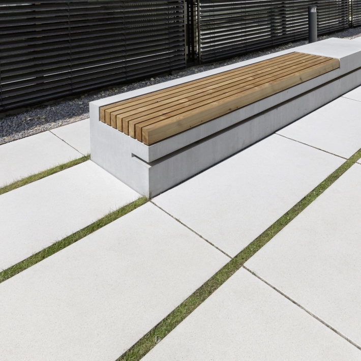 Concrete seating element with wooden support