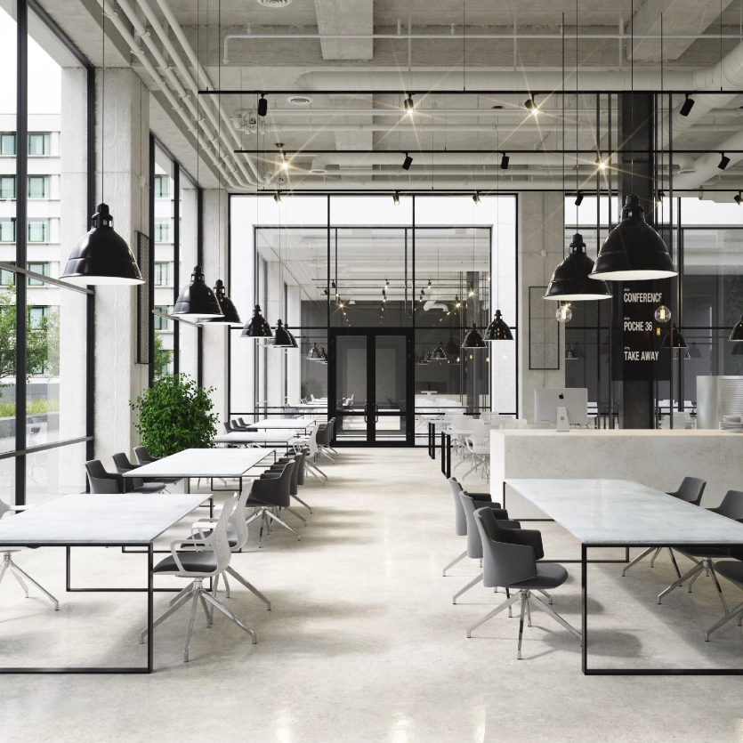 Large, bright entrance area with concrete tables