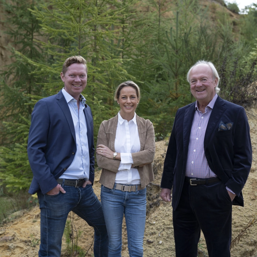 The three Godelmann managing directors standing in the company's own sand pit in front of a renatured area.