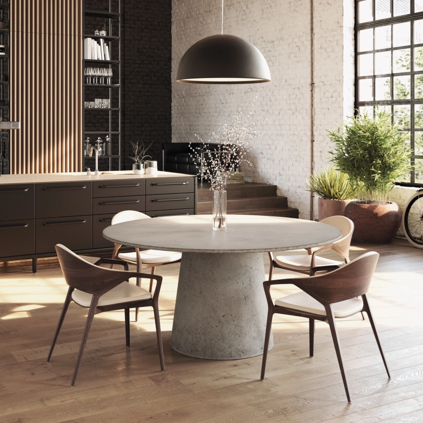 Round concrete table in a bright apartment