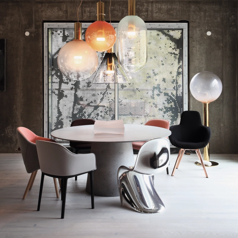 Round concrete table in an industrial-style apartment