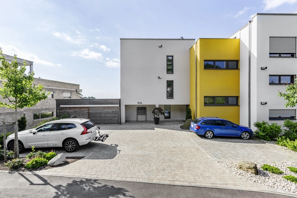 modern apartment building planted driveway 